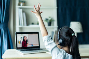 Photo of a child doing remote schooling.